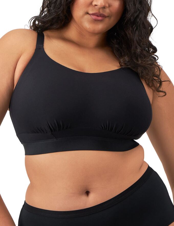 A bralette worn to show at the neckline of a tank top